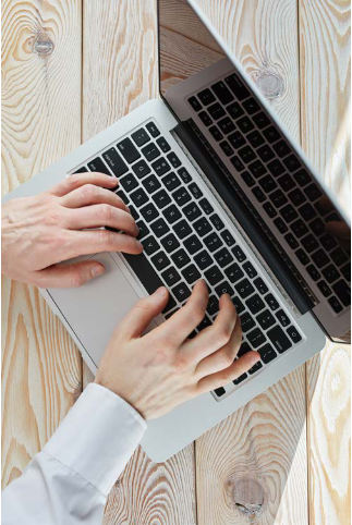 image of a user working on a laptop