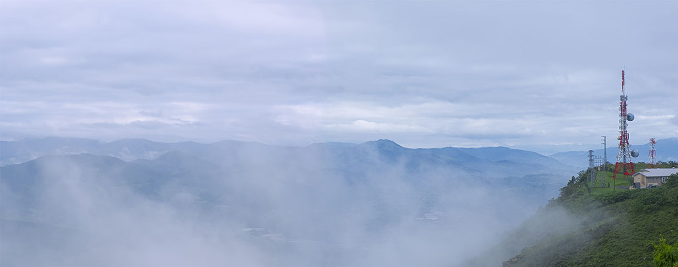 Antennas in a misty landscape.